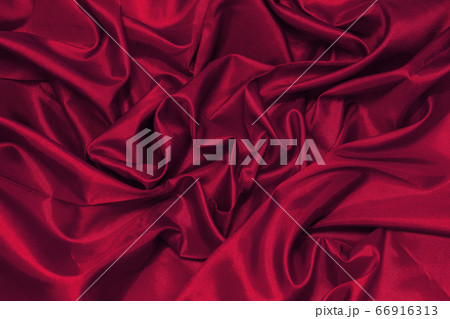 Top view of luxury red fabric or liquid wave or wavy folds of grunge silk texture satin velvet material or luxurious Christmas background or elegant wallpaper design, Red Canvas for Background. 66916313