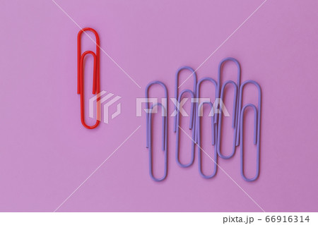 Colored paper red clip outstanding on purple background. minimal concept. Ideas about showing leadership in various ways. education, better business 66916314