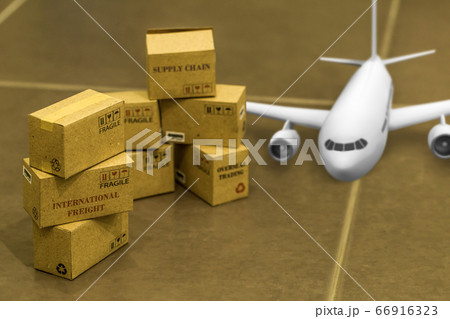 Pile of small boxes and airplane. Concept of transportation that can be done easily using an online internet. Shipping, For the convenience of customer service. delivery and transportation logistics. 66916323