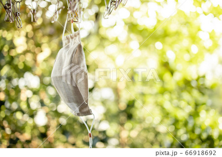 Organic Cotton Face Mask Hanging on Clothesline. 66918692