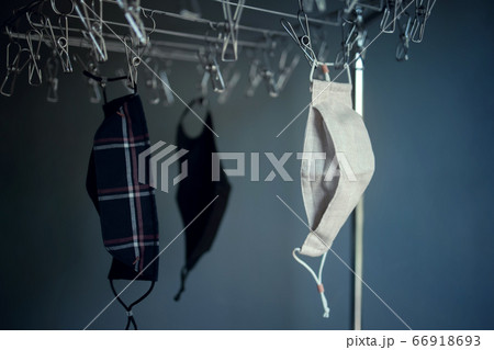 Organic Cotton Face Mask Hanging on Clothesline. 66918693