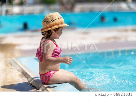Child In Swimming Pool with ring. Summer Vacation With Kids. Child In Swimming Pool with ring. Summer Vacation With Kids. 66921633