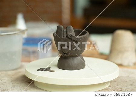 Closeup clay work in rabbit face with ribbon on 66921637