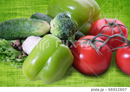 fresh eggplant squash zucchini garlic cucumber paprika on green background 66922607