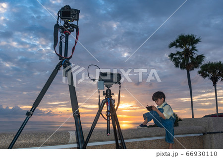 .The camera is capturing pictures of a cute boy .The camera is capturing pictures of a cute boy 66930110