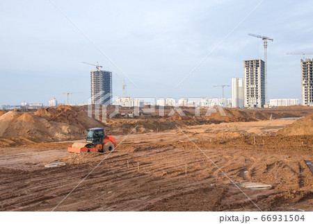 Vibration single-cylinder road roller leveling the ground for the foundation. Soil Compactor 66931504