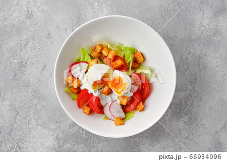 Salad with tomato, radish, egg and crouton Salad with tomato, radish, egg and crouton 66934096