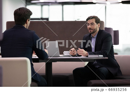 Job interview, hr manager interviewing male candidate asking questions Job interview, hr manager interviewing male candidate asking questions 66935256