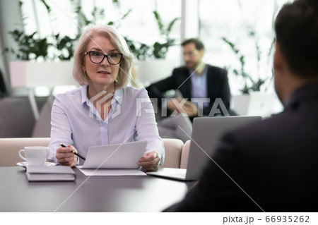 Adult business woman interview job candidate holding resume 66935262