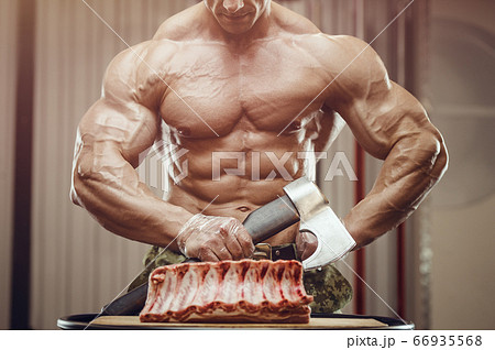 Fitness man at workout in gym 66935568