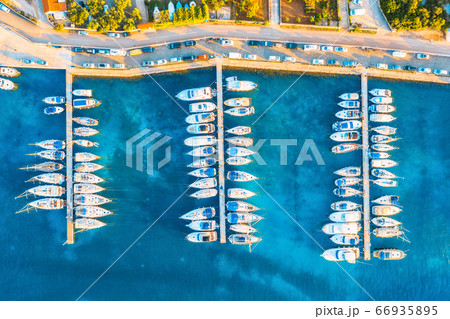 Aerial view of boats and yachts in port in beautiful old city at sunset in Croatia in summer Aerial view of boats and yachts in port in beautiful old city at sunset in Croatia in summer 66935895