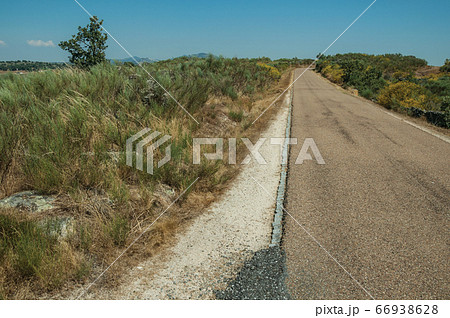 Road through wild landscape Road through wild landscape 66938628