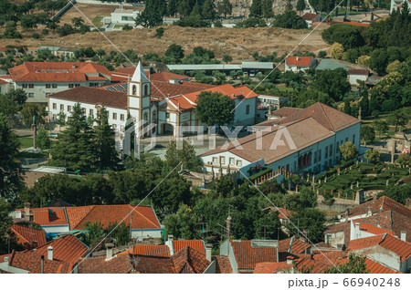 City landscape with old building roofs and church 66940248