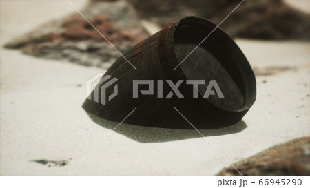 Old wooden barrel on the beach Old wooden barrel on the beach 66945290