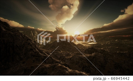 Sun Rays over Mountains in a Valley 66945442