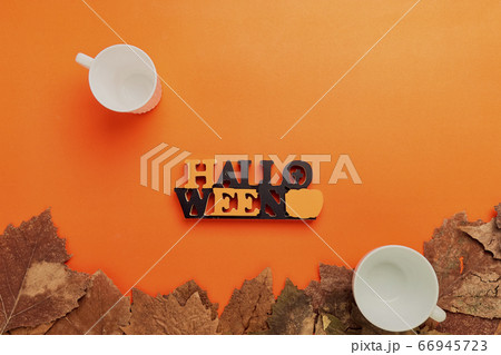 Halloween background, Blank cup and dry leaves on Halloween background, Blank cup and dry leaves on 66945723