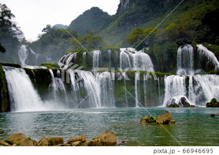 Dark and moody cinematic scenery of Ban Gioc or Detian Falls in Cao Bang, Vietnam during the winter season Dark and moody cinematic scenery of Ban Gioc or Detian Falls in Cao Bang, Vietnam during the winter season 66946695