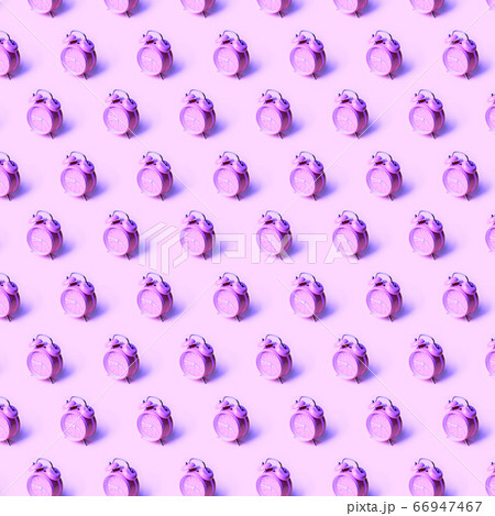 Creative layout of purple alarm clock's on neon purple background. Minimal concept. 66947467