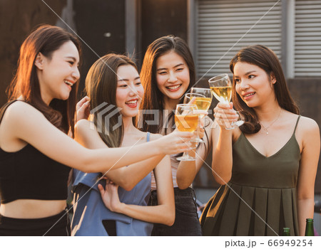 young beautiful happy asian women holding bottle young beautiful happy asian women holding bottle 66949254