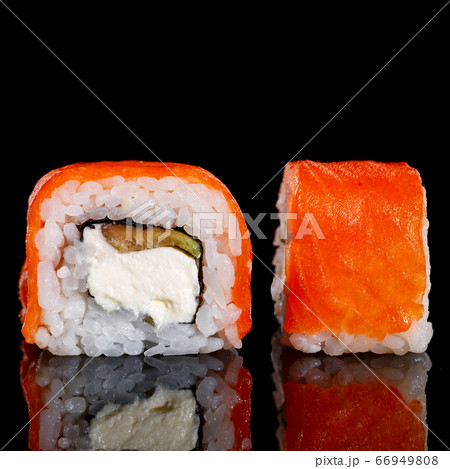 Two pieces of sushi closeup on black background. Two pieces of sushi closeup on black background. 66949808