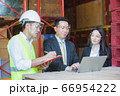 warehouse manager working on laptop. Occupation, 66954222