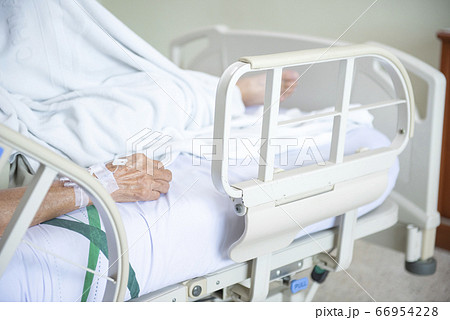 Hand of elder Asian woman patient on bed in 66954228