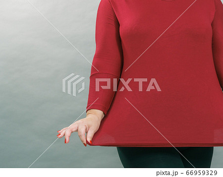 Woman plus size in red tunic Woman plus size in red tunic 66959329