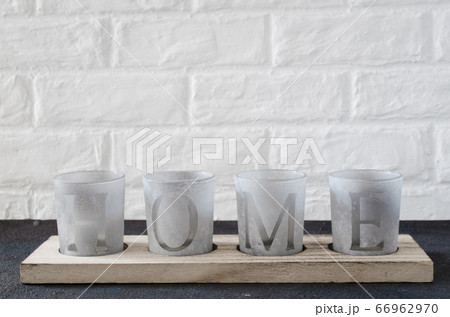 Cozy home interior decor, candlesticks with the inscription home. Cozy home interior decor, candlesticks with the inscription home. 66962970