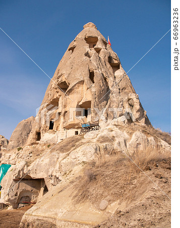 Volcanic mountain with windows near the city of Goreme in Turkey. Cappadocia. 66963236