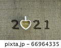 2021 coffee beans and cup of heart shape on sack texture background, New Year concept 66964335