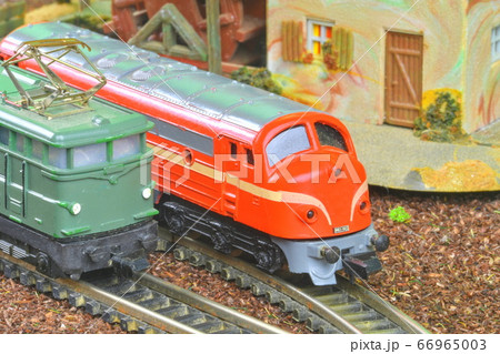 Perfect model of the electric locomotive and diesel locomotive. Train hobby model on the model railway. Close-up 66965003