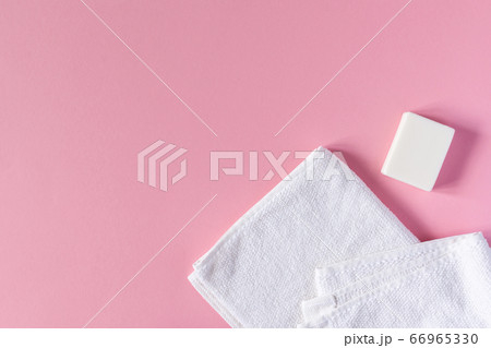 Towel with soap on a pink background Towel with soap on a pink background 66965330