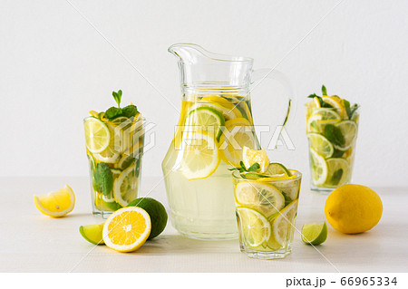 Jug with lemonade and glasses Jug with lemonade and glasses 66965334