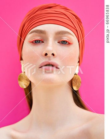 Closeup portrait of red-haired girl on pink background. Beauty fashion concept. Summer mood. Closeup portrait of red-haired girl on pink background. Beauty fashion concept. Summer mood. 66965838