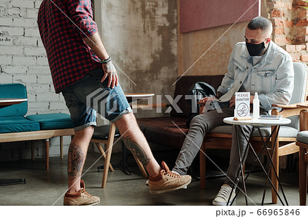 Greeting each other with foot gesture Greeting each other with foot gesture 66965846