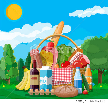 WIcker picnic basket full of products. 66967126