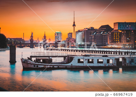 Berlin skyline with old ship wreck in Spree river at sunset, Germany 66967419