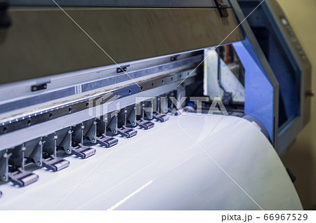 Large inkjet printer printing on vinyl paper 66967529