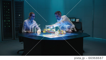 Engineers working on car 66968687