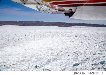 Greenlandic melting ice sheet glacier aerial view 66970504