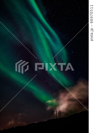 Green Aurora Borealis Northern lights shining with 66970511
