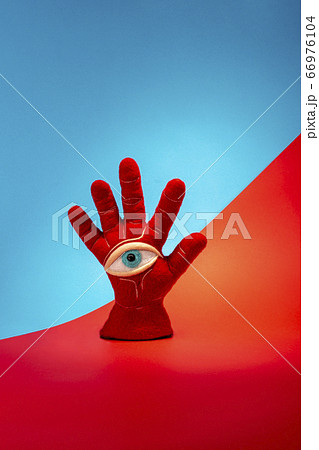 Protective amulet in the shape of an open palm and eye made of felted wool 66976104