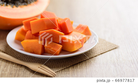Sliced ripe papaya fruit on plate, Tropical fruit	 66977817