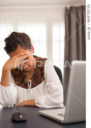 Freelancer woman covering her face Freelancer woman covering her face 66978556