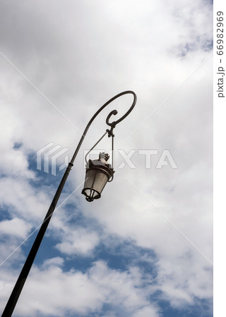 Closeup of vintage street lamp on beautiful cloudy 66982969