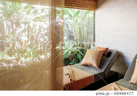 Wellness spa beds behind curtain in garden. Thai spa room Wellness spa beds behind curtain in garden. Thai spa room 66986477