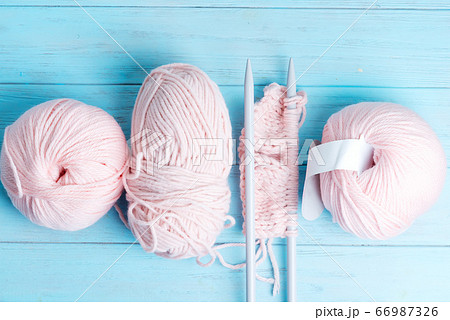 Top view of winding wools and knitting pattern on 66987326