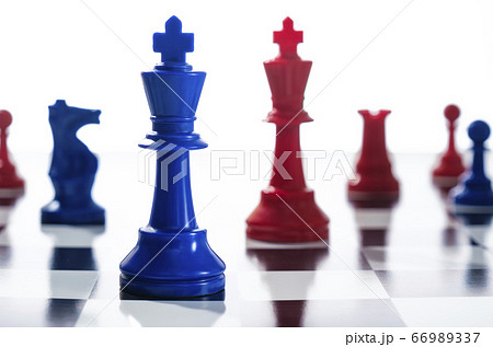 Studio shot of red and blue chess pawns symbolizing US Democratic and Republican parties Studio shot of red and blue chess pawns symbolizing US Democratic and Republican parties 66989337