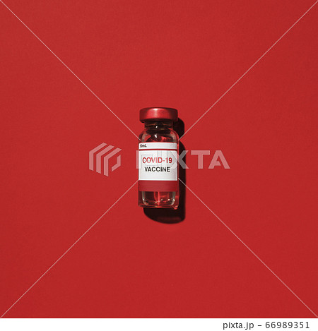 Studio shot of vial with Covid-19 vaccine Studio shot of vial with Covid-19 vaccine 66989351
