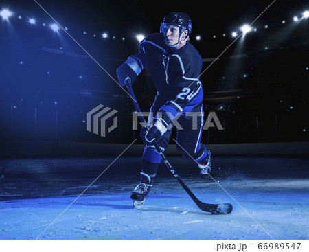 Hockey player on ice 66989547